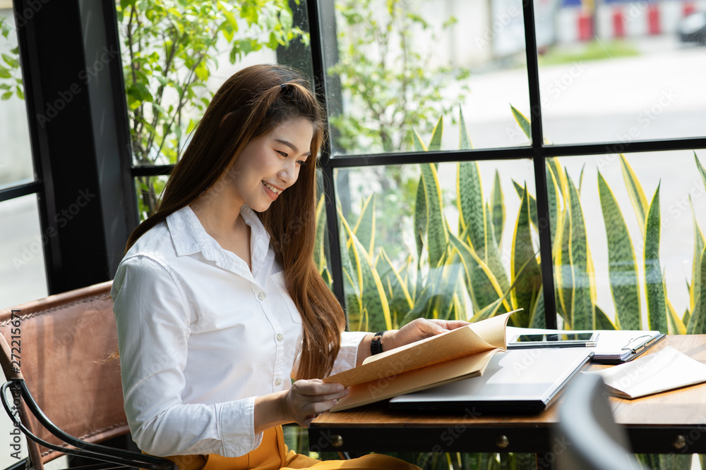 Beautiful Attractive Asian woman reading book for learn and education smile and positive thinking feeling so happiness and comfortable,Education Concept Beautiful Attractive Asian woman reading book for learn and education smile and positive thinking feeling so happiness and comfortable,Education Concept