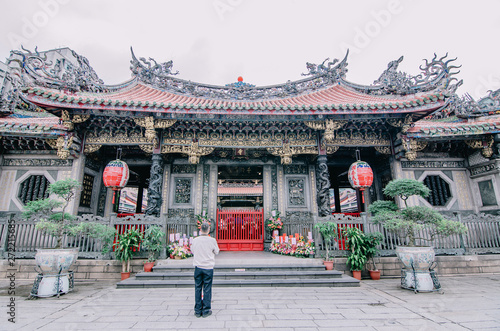People pray in Longshan Buddhist temple in Taipei city, Taiwan , The landmark temple dates from 1738. photo