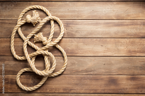 ship rope at wooden background texture