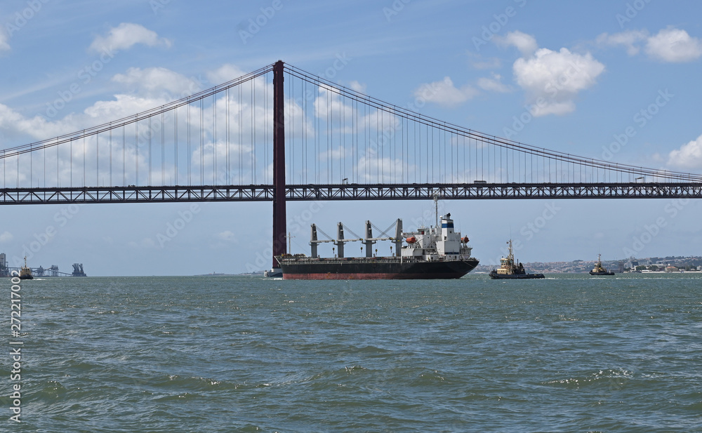 Fototapeta premium cargo under bridge in Lisbon, Portugal