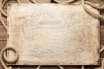 ship rope at wooden board background