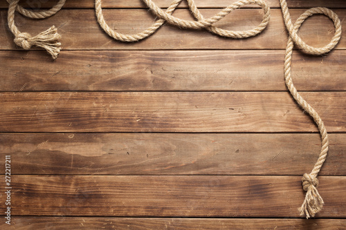 ship rope at wooden board background