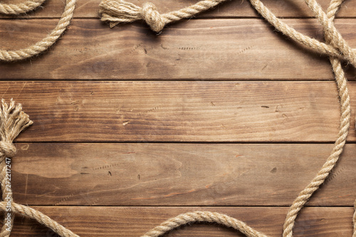 ship rope at wooden board background
