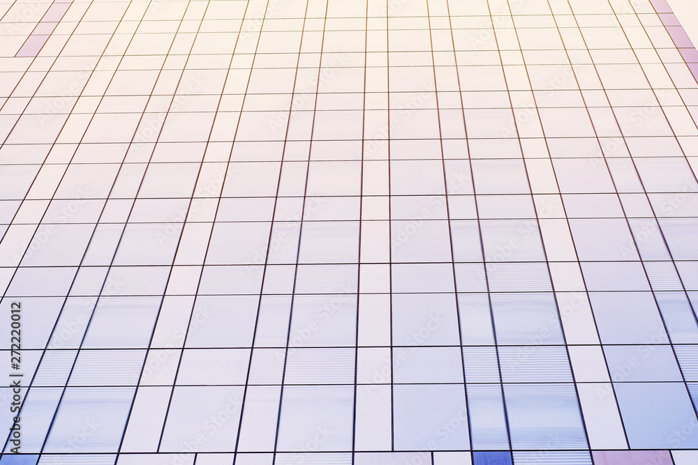 Blue toning background with part of a modern business center building Blue toning background with part of a modern business center building