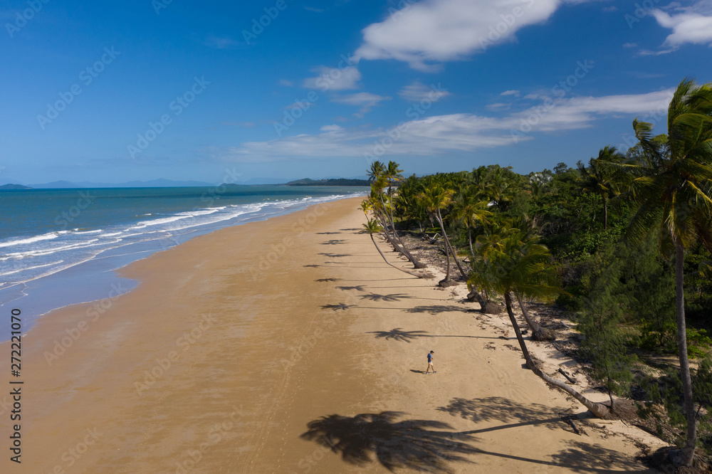 Aerial top view of beach with white sand, beautiful palm trees and warm turquoise tropical water Aerial top view of beach with white sand, beautiful palm trees and warm turquoise tropical water