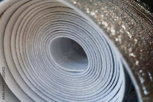 A roll of insulation material from foamed polyurethane close up