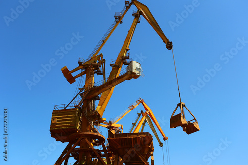 Industrial cargo port with operating cranes on the Danube river
