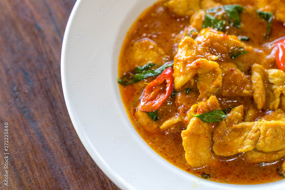 Thai Red Curry with Pork on wooden table Thai Red Curry with Pork on wooden table