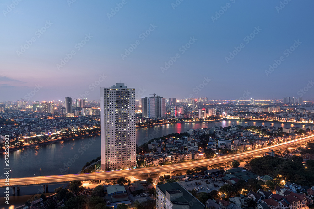 Obraz premium Aerial skyline view of Hanoi at Linh Dam lake, Belt Road No. 3. Hanoi cityscape by sunset period