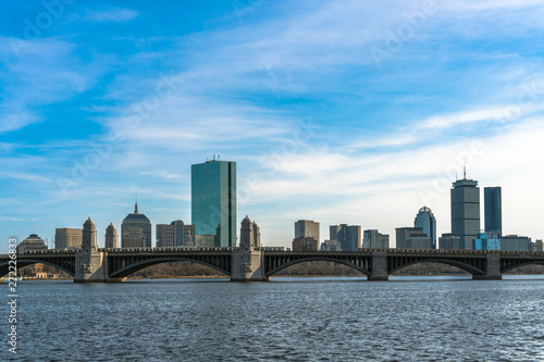 Scene of Train running over the Longfellow Bridge the charles river at the evening time  USA downtown skyline  Architecture and building with transportation concept