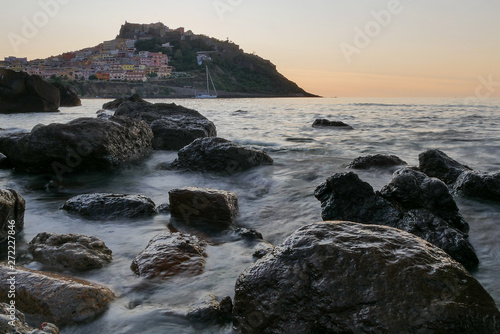 castelsardo by sunset. blurry sea and rocks. italy. sardinia. 