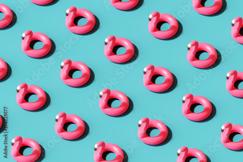 Flamingo float pattern on blue background. Summer concept. 3d rendering photo