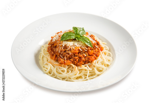 pasta bolognese with basil on a plate on a white background