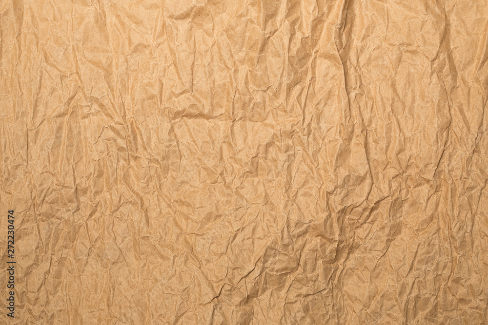 Shabby light brown kraft paper background in evening sunlights Shabby light brown kraft paper background in evening sunlights