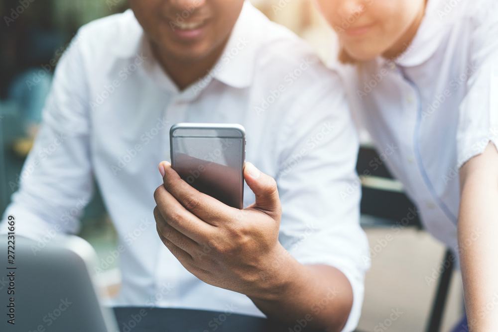 Business man and woman using smartphone. Working concept. Business man and woman using smartphone. Working concept.