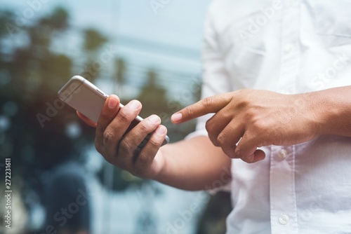 Close up hand man using smartphone