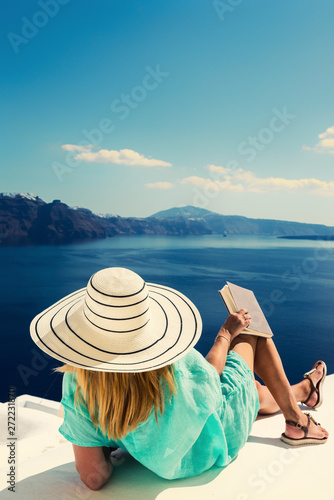Luxury travel vacation woman looking at view on Santorini island