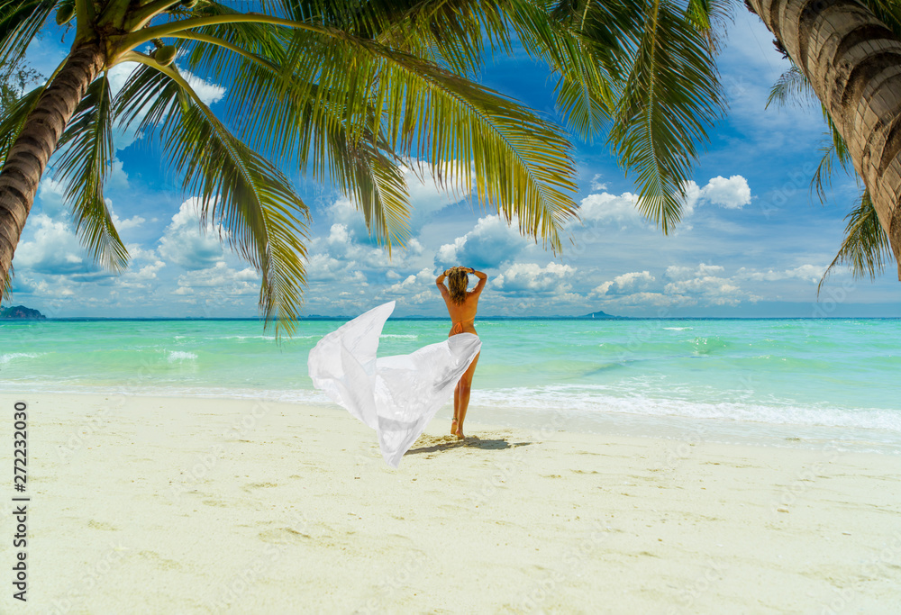 Woman enjoying her holidays on the tropical beach i Woman enjoying her holidays on the tropical beach i