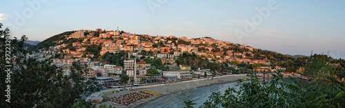 Fototapeta Naklejka Na Ścianę i Meble -  Panoramic view on Ulcinj old town fortress with purple after sunset light. Adriatic sea at sunset in Montenegro.
