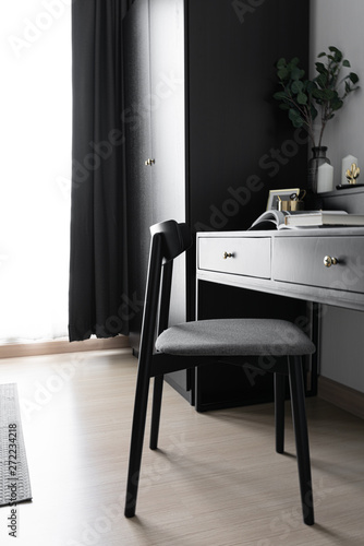 Dressing table corner with black wood power table and black wooden chair  decoration in natural light scene / cozy interior concept / black interior scandinavian style /interior design © Nut