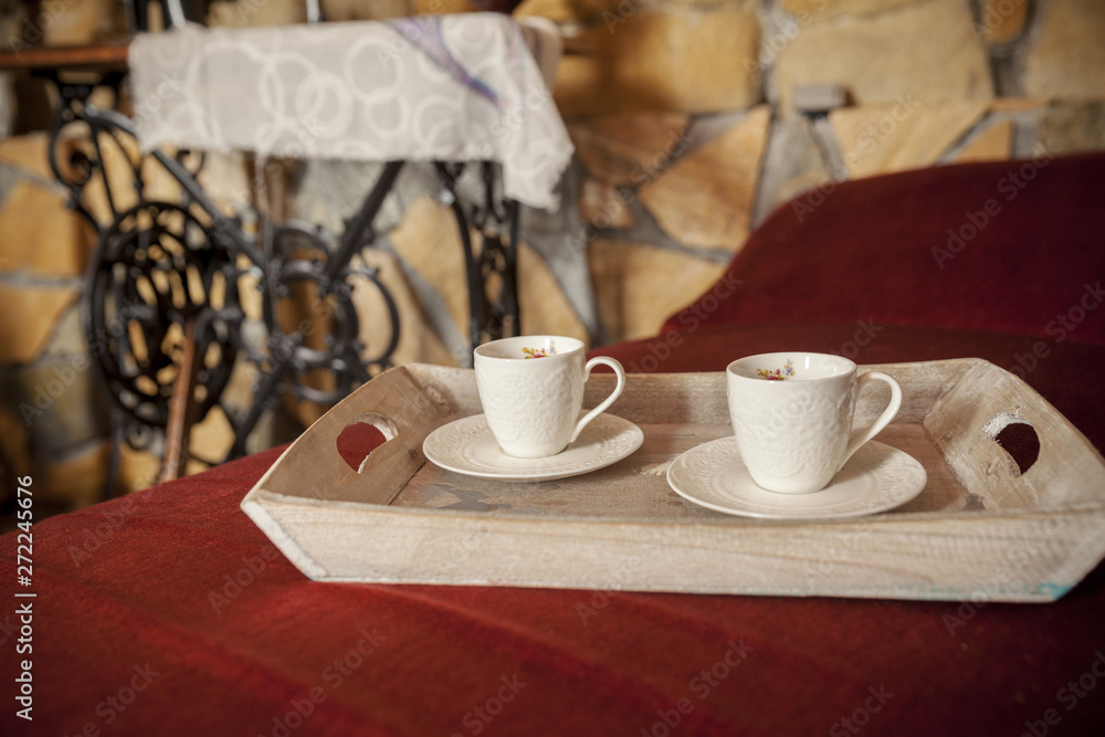 Obraz premium two antique cups of coffee on the old tray