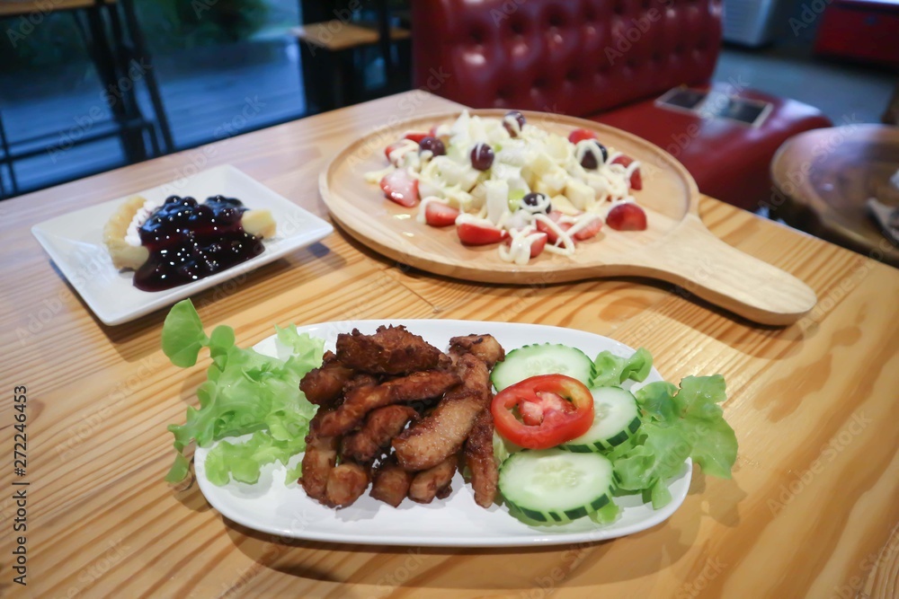 fruit salad, blueberry cheese cake and fried pork fruit salad, blueberry cheese cake and fried pork