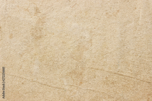 Cover of an old book close-up. Background tissue structure. Beige.