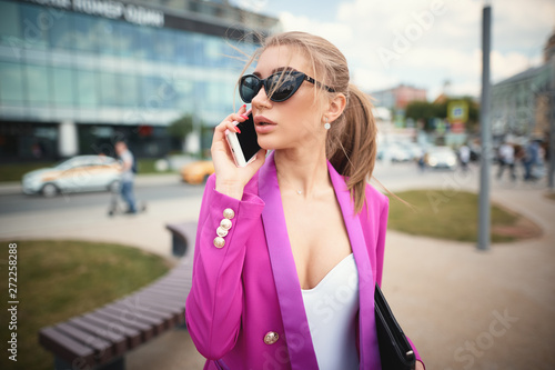 Fototapeta Naklejka Na Ścianę i Meble -  Young beautiful business woman talking on the phone. Business concept  
