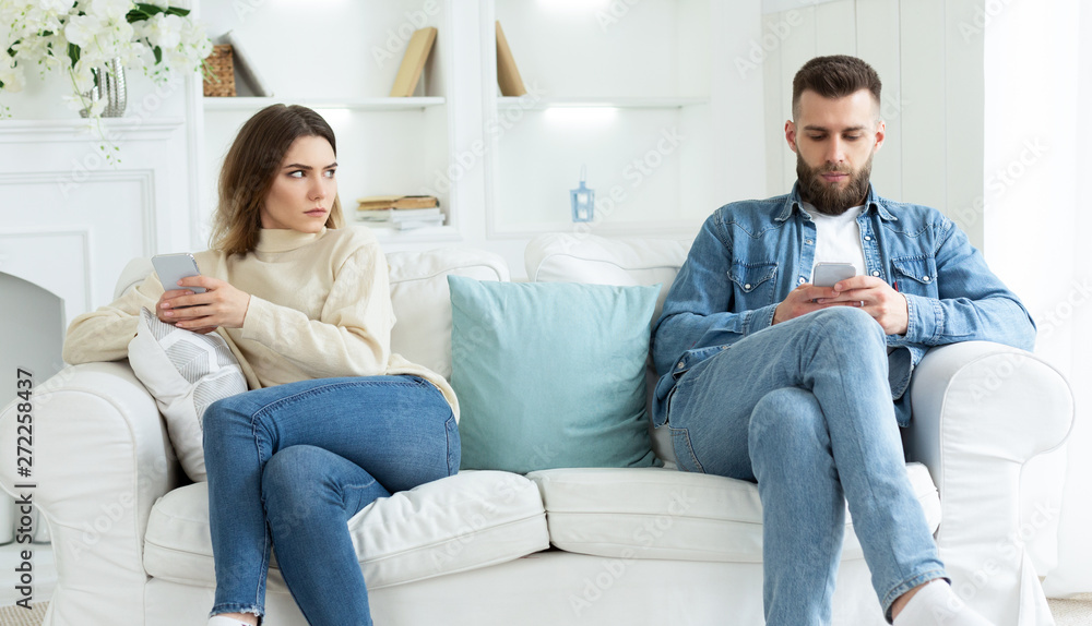 Couple Crisis. Man Using Phone, Not Paying Attention To Wife