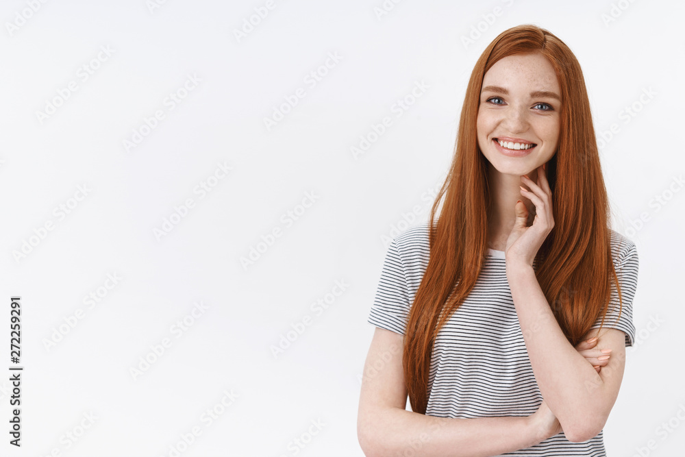Charming elegant cute redhead woman long straight hairstyle touching neck silly blushing smiling camera entertained listen intrigued camera taking part conversation, flirty glance, white background Charming elegant cute redhead woman long straight hairstyle touching neck silly blushing smiling camera entertained listen intrigued camera taking part conversation, flirty glance, white background