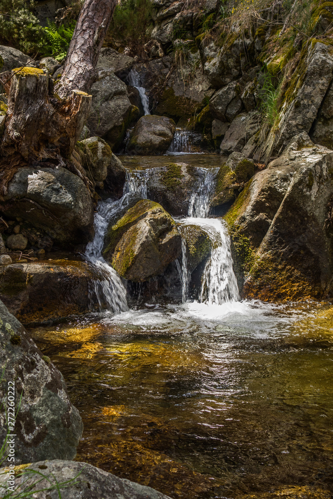 Waterfall in the forest. Lozoya river. Hiker route in the Waterfall in the forest. Lozoya river. Hiker route in the