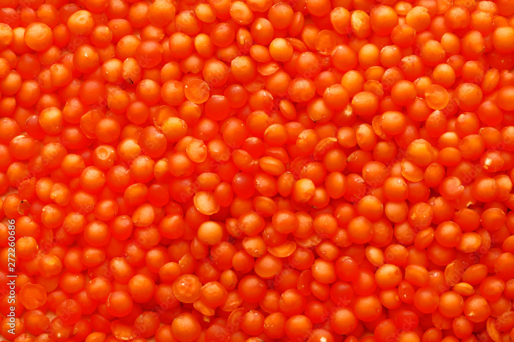 Orange lentils background, closeup Orange lentils background, closeup