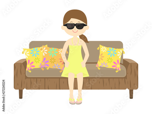 リゾートソファに座る女性のイラスト