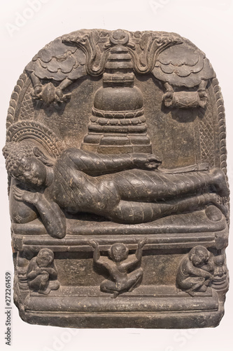 Archaeological sculpture of Mahaparinirvana, made of Basalt rock. Circa tenth century of the Common Era, Dinajpur, West Bengal, India