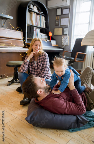 Happy young family playing ...