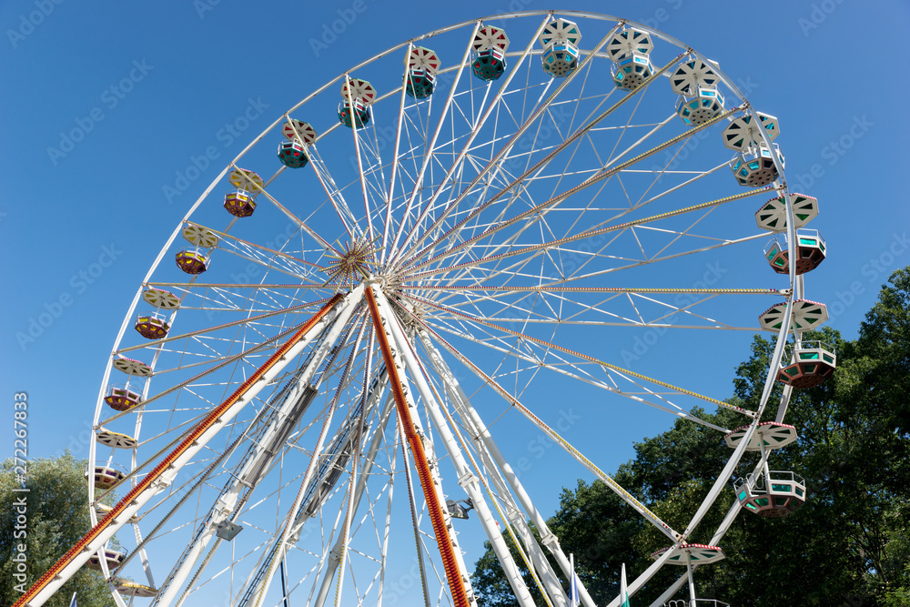 Big ferris wheel in front of blue sky in summer