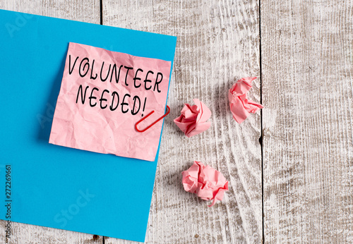 Writing note showing Volunteer Needed. Business concept for asking demonstrating to work for organization without being paid Wrinkle paper and cardboard placed above wooden background