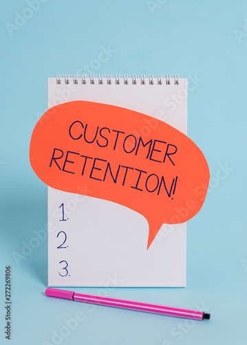 Handwriting text writing Customer Retention. Conceptual photo Keeping loyal customers Retain analysisy as possible Standing blank spiral notepad speech bubble pen lying cool background