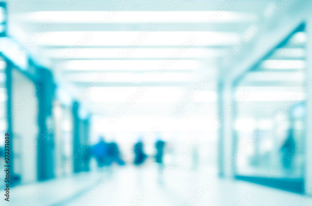 Blur store with bokeh background. Silhouettes of Business People in Blurred Motion Walking. Business people walking in the office corridor. Blur store with bokeh background. Silhouettes of Business People in Blurred Motion Walking. Business people walking in the office corridor.