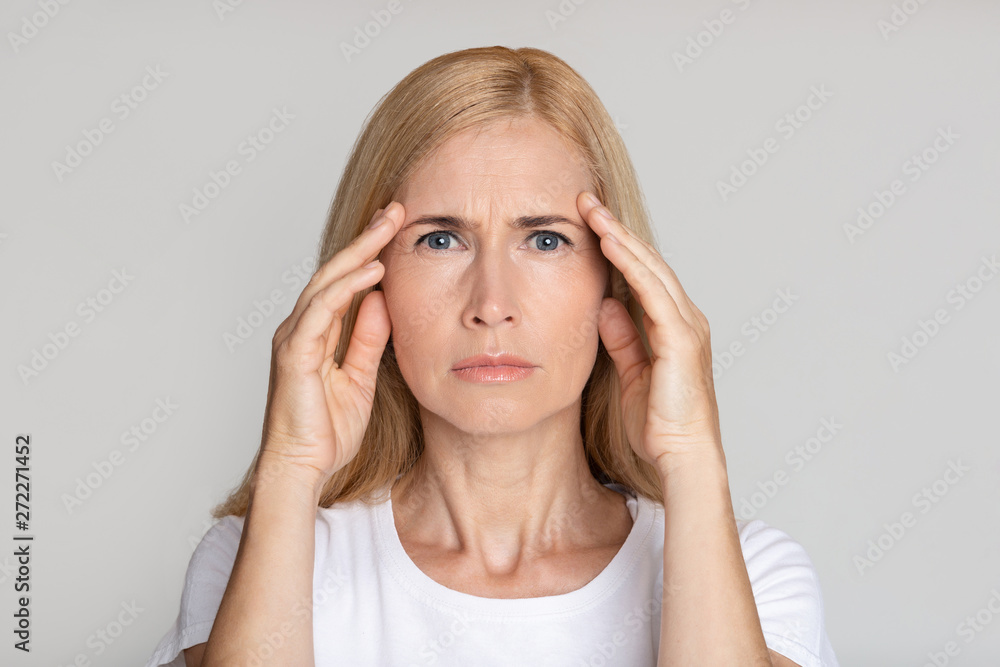 Stressed Mature Woman Touching Temples, Having Headache Stressed Mature Woman Touching Temples, Having Headache