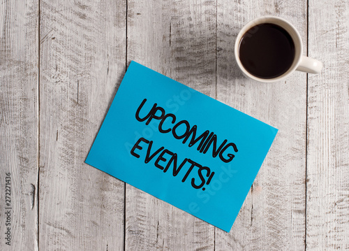 Text sign showing Upcoming Events. Business photo showcasing thing that will happens or takes place soon planned occasion Pastel Colour paper placed next to a cup of coffee above the wooden table