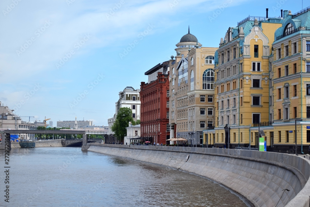Moscow, Russia - May 13, 2019: Buildings on the Yakimanskaya Embankment and Moscow River on a sunny day