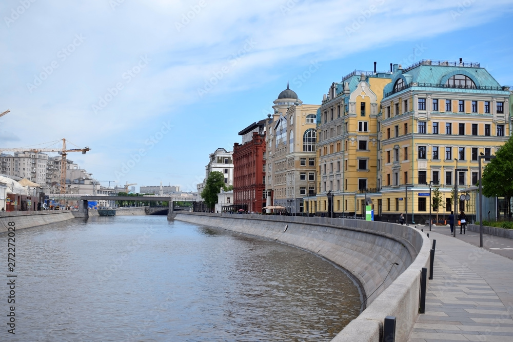 Moscow, Russia - May 13, 2019: Buildings on the Yakimanskaya Embankment and Moscow River on a sunny day