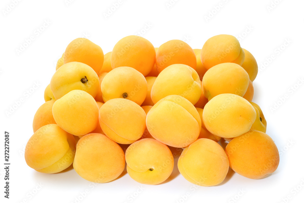 Ripe juicy orange apricots isolated on white background.