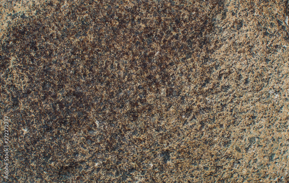 Dark colored stone. The texture of the stone. Natural background. Dark colored stone. The texture of the stone. Natural background.