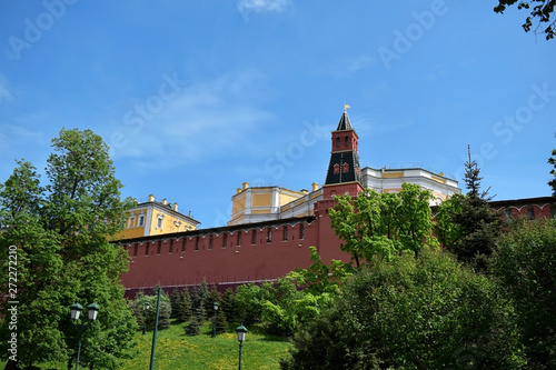 Photography Moscow, Russia - May 13, 2019: The Middle Arsenalnaya Tower surrounded by verdure against the clear blue sky