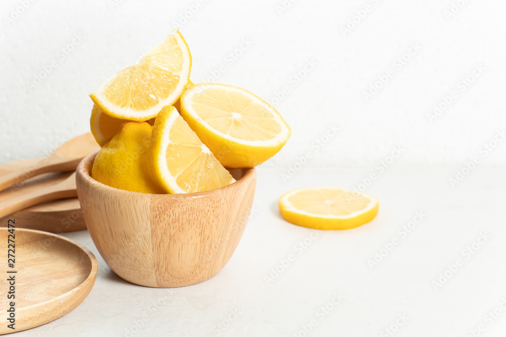 fresh natural lemon fruit vegetable with wet waterdrop, kitchen table wall white background, organic food and nutrition vitamin citrus, diet and healthy, tropical juice, wood dish cup and spoon fresh natural lemon fruit vegetable with wet waterdrop, kitchen table wall white background, organic food and nutrition vitamin citrus, diet and healthy, tropical juice, wood dish cup and spoon