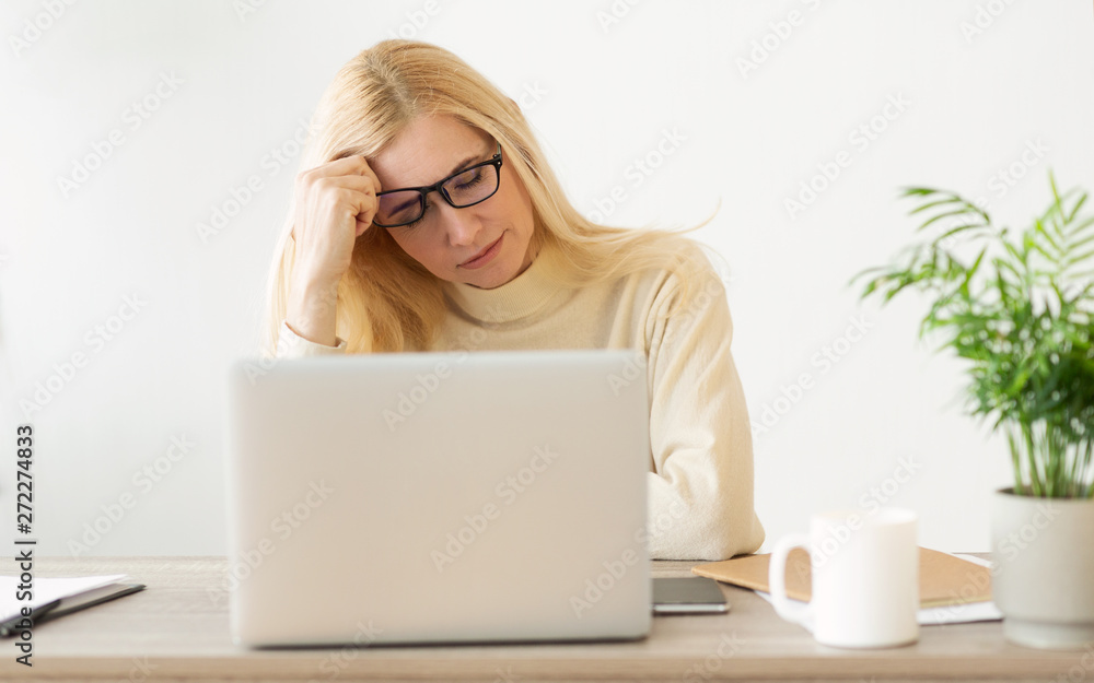Feeling Tired And Stressed. Woman Working On Laptop Feeling Tired And Stressed. Woman Working On Laptop