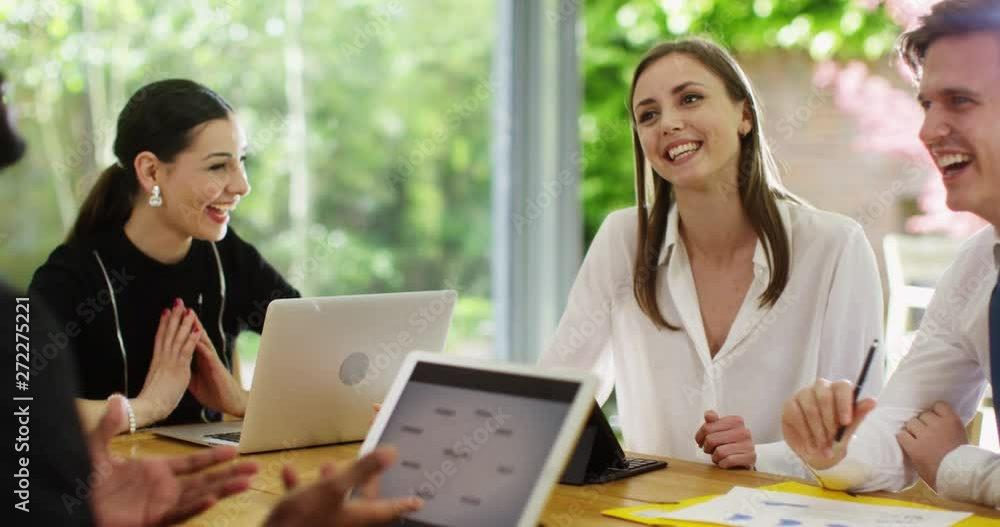 4K Happy multi-ethnic business group chatting & laughing together at work. Slow motion. 4K Happy multi-ethnic business group chatting & laughing together at work. Slow motion.