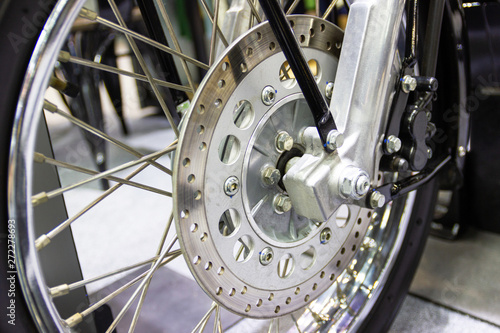 close up - wheel spokes and brake disc of a motorcycle